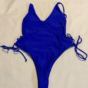 Size small royal blue one piece high cut swimsuit.  Open back